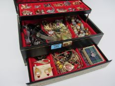 Costume jewellery in black and gilt box