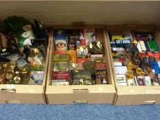 Old tins, die-cast toys, brassware and miscellanea in three boxes