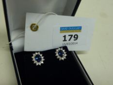 Pair of sapphire (each approx 1 carat) and diamond cluster white gold ear-rings hallmarked 18ct