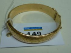 Gold hinged bangle with bright cut decoration hallmarked 9ct approx 22.6gm