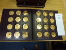 Cased set of thirty-six bronze-gilt medals by Pinches depicting Chaucer`s Canterbury Tales