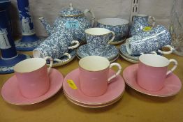 Royal Worcester blue foliate and gilt five place coffee set and Royal Worcester pink and gilt coffee