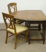 Medium oak gateleg dining table with carved border and four chairs