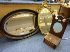 19th Century bevelled edge wall mirror with figured veneer and a gilt wood rococo style mirror,