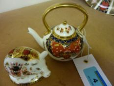 Royal Crown Derby miniature pig paperweight and a Royal Crown Derby miniature tea kettle