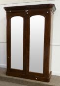 Victorian mahogany double wardrobe enclosed by arch top mirror doors, W145cm x H203cm
