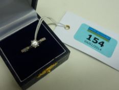 Diamond solitaire ring with diamond set shoulders hallmarked 9ct