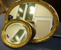 Oval gilt framed mirror, another similar smaller