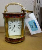 Miniature enamel carriage clock of oval form