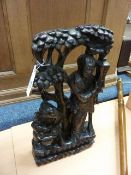 Chinese carved wooden figural group decorated with brass wire inlays, 42cm high
