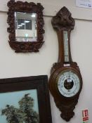 Carved oak wheel barometer by J Durkin, Middlesbrough, Mid 20th Century and a carved stained