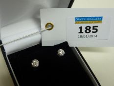 Pair of diamond rub-over ear-rings stamped 750 (approx 0.33 carat)