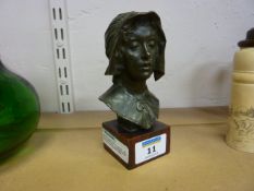 Continental bronze bust of a woman, Late 19th/ Early 20th Century, on variegated rouge marble