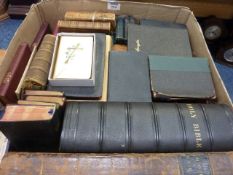 Collection of bibles and religious books in one box