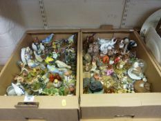 Collection of ceramic and resin birds and other animals include RSPB models in two boxes