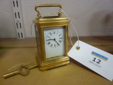 Miniature brass and four glass carriage clock
