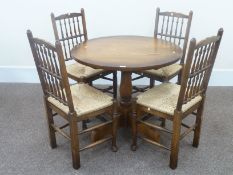 Solid oak circular pedestal table 91cm and four Lancashire spindle back chairs with rush seats