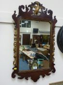 Early 20th Century mahogany wall mirror in the Chippendale style carved with dodo bird fretwork