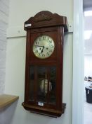 Early 20th Century mahogany cased wall clock with striking movement and bevelled glass panels 76cm