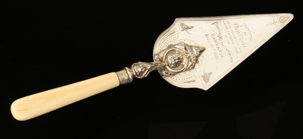 A 19c silver plated presentation trowel with ivory handle engraved "Presented to Miss Clarke on