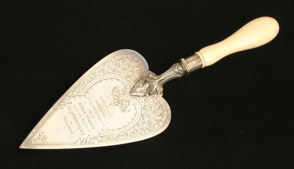 A large silver plated presentation trowel with Presented to J.J.Banning Esq. on Laying one of the