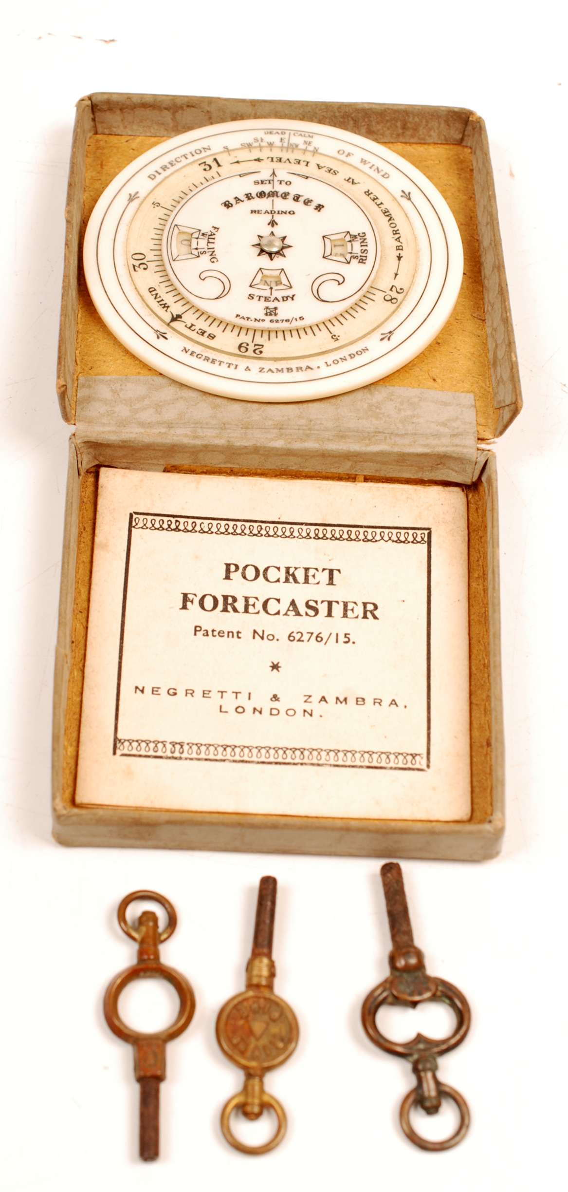 A Negretti & Zambra, London circular ivorine "Pocket Forecaster" with its instructions and in its
