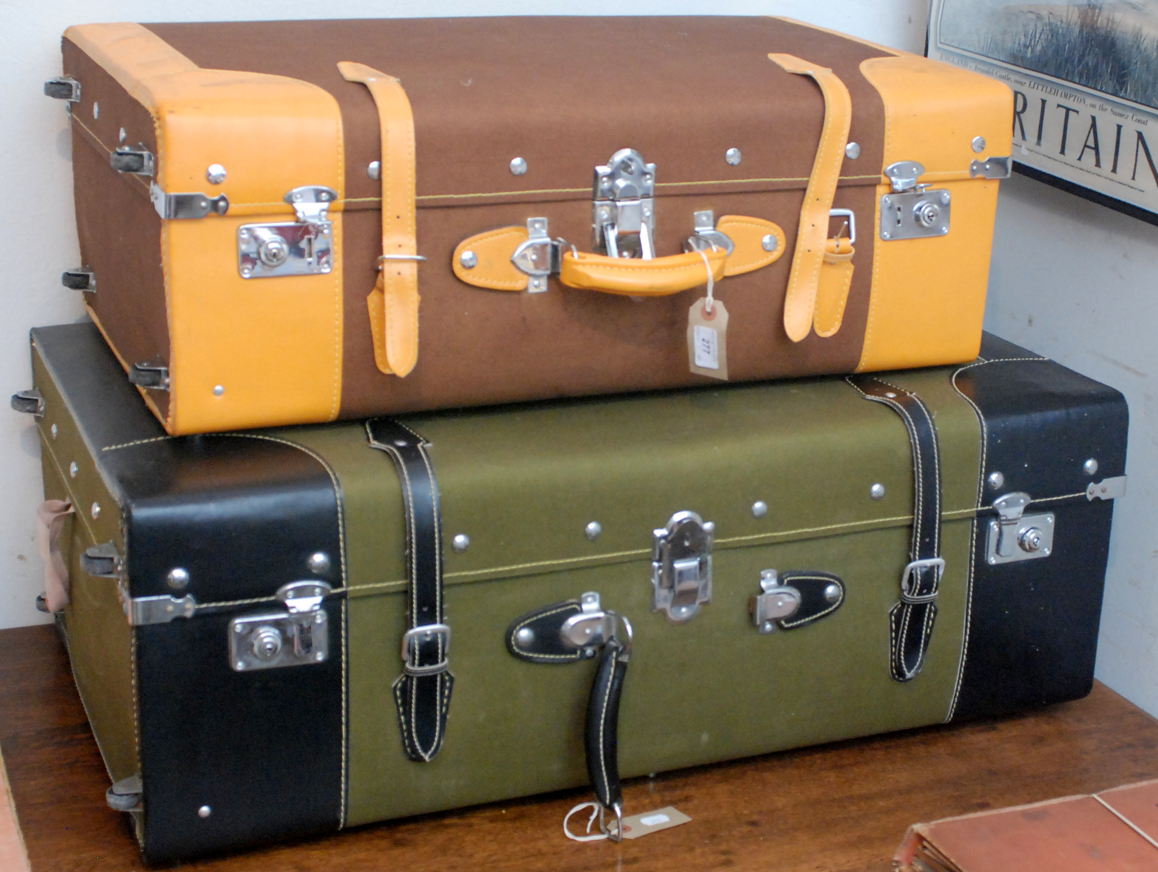 Two canvas clad suitcases.