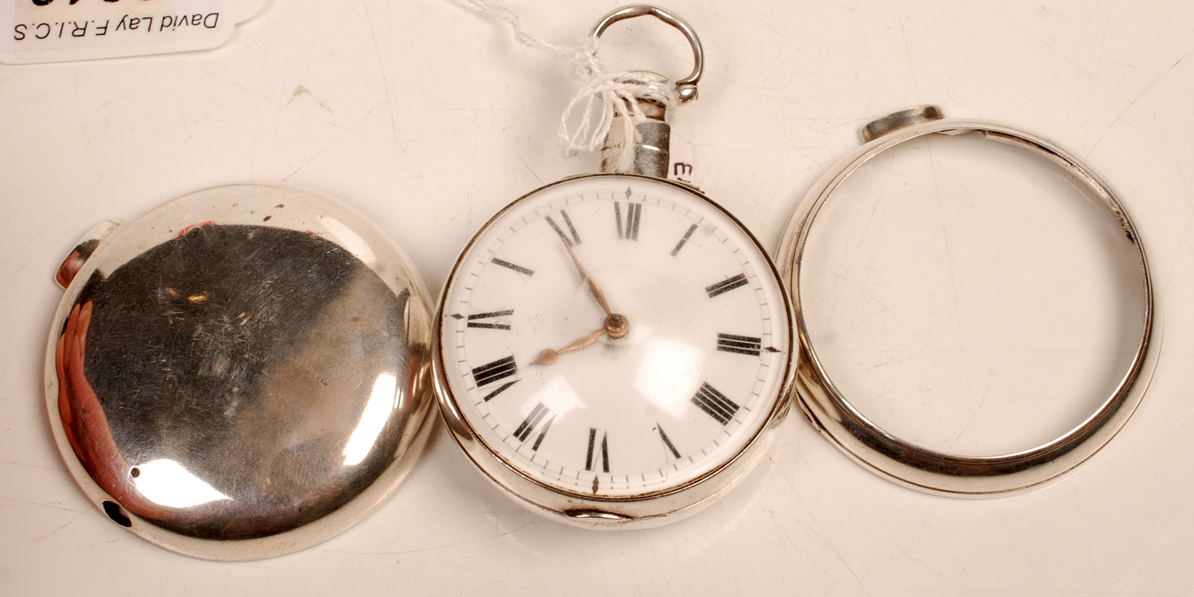 A George IV silver pair cased pocket watch. The verge movement signed Emanuel Cohen Redruth.