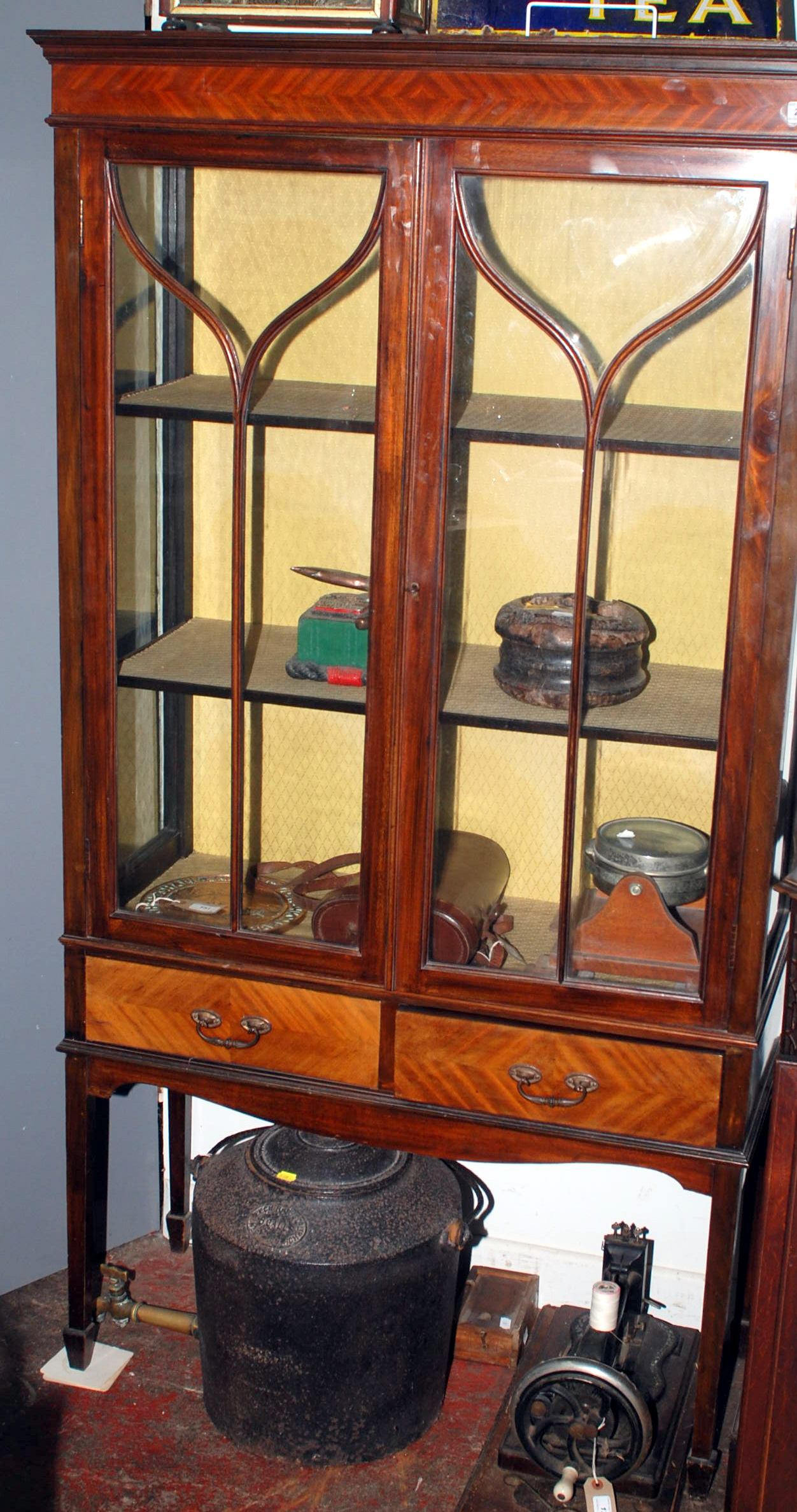 A mahogany display cabinet, the glazed doors over a pair of drawers. Condition Report: Dimensions: