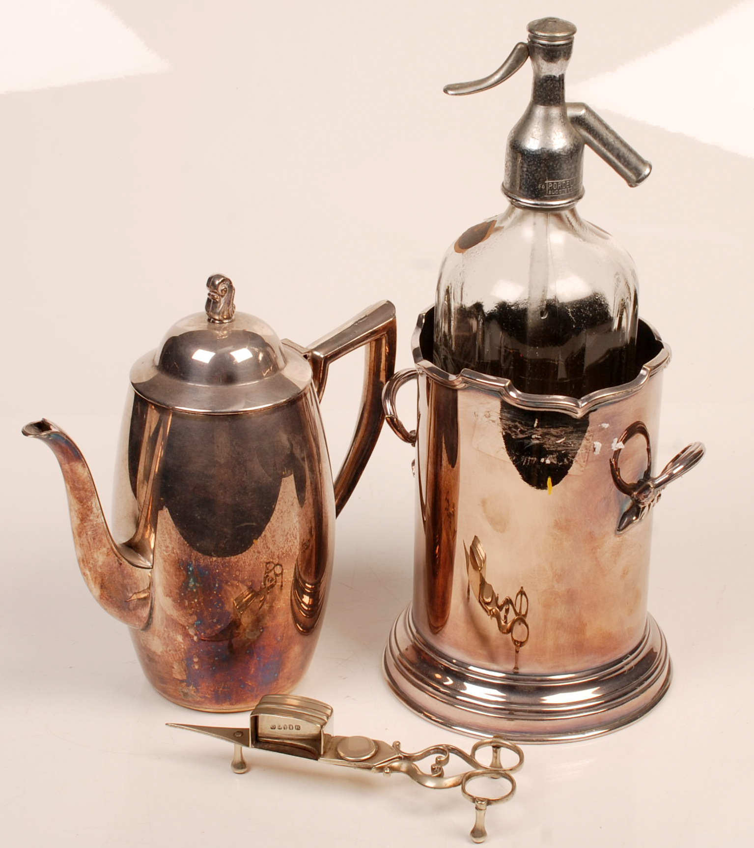 A soda syphon stand by John Pound & Co. with cast handles, a jug with a cast finial and a pair of