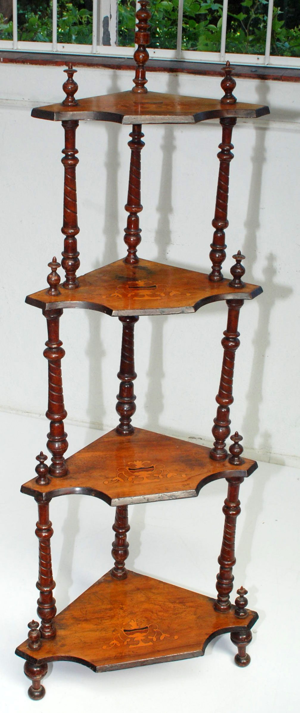 A Victorian walnut veneered corner whatnot.