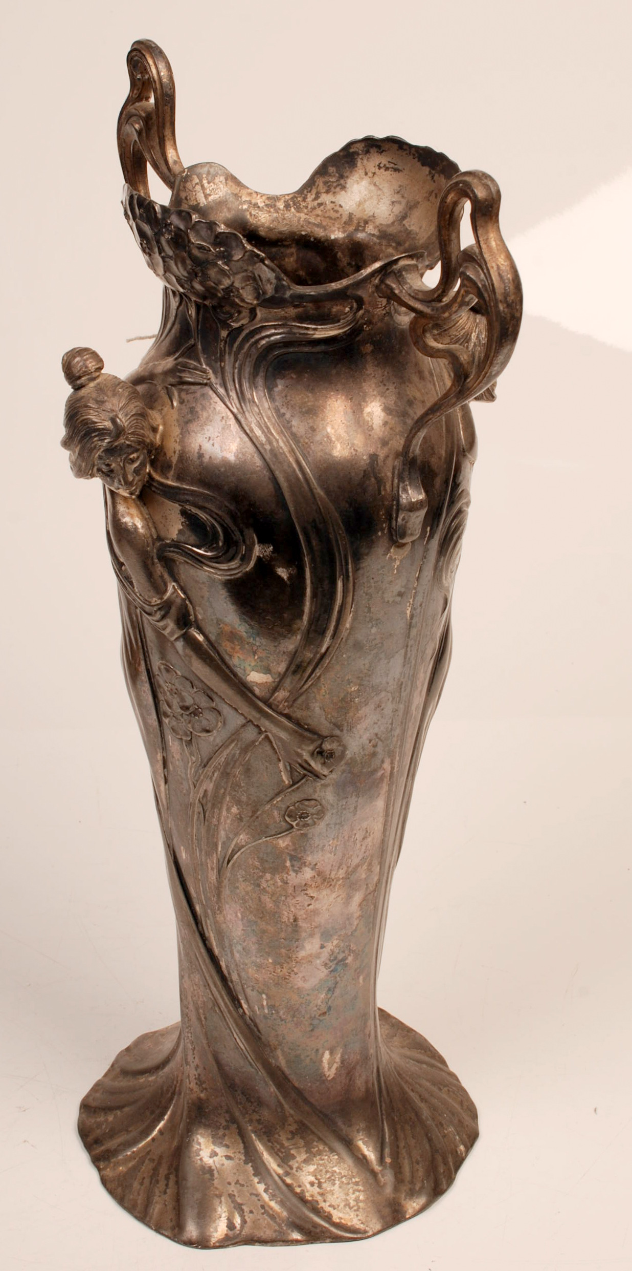A W.M.F. Art Nouveau twin handled vase cast with female figures about it, height 36cm. Condition