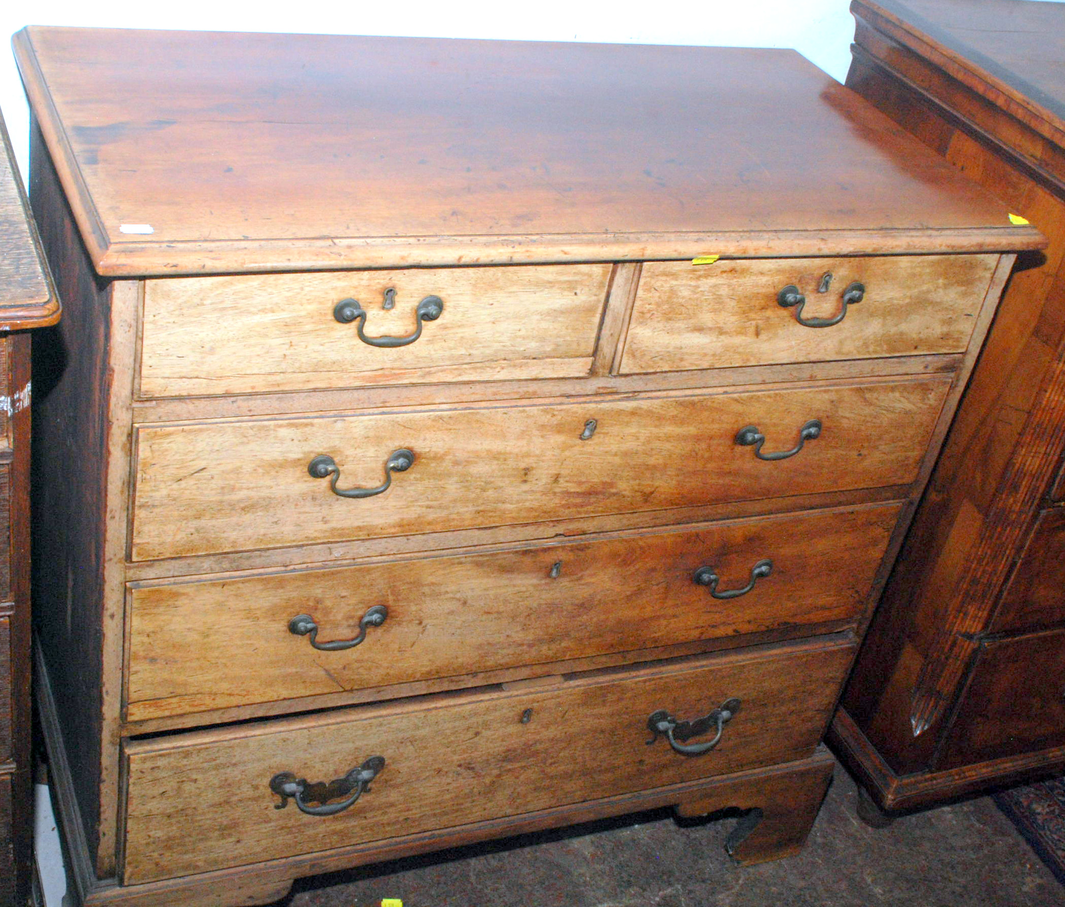 An 18th century mahogany chest of small proportions fitted two short and three long graduated