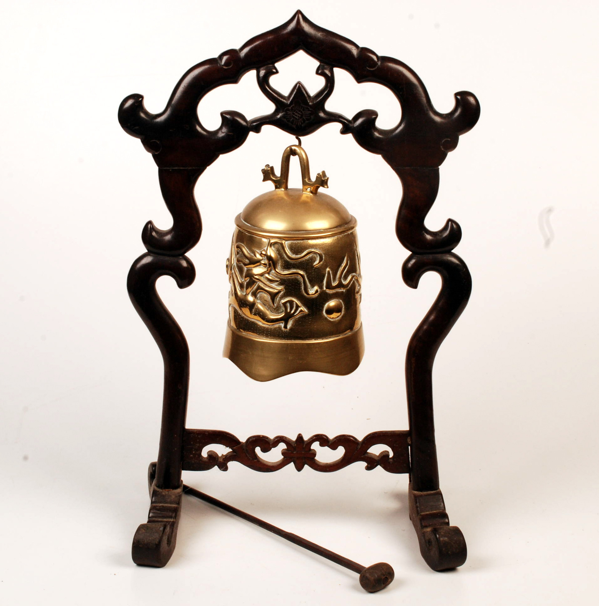 A Chinese brass bell in shaped stand.