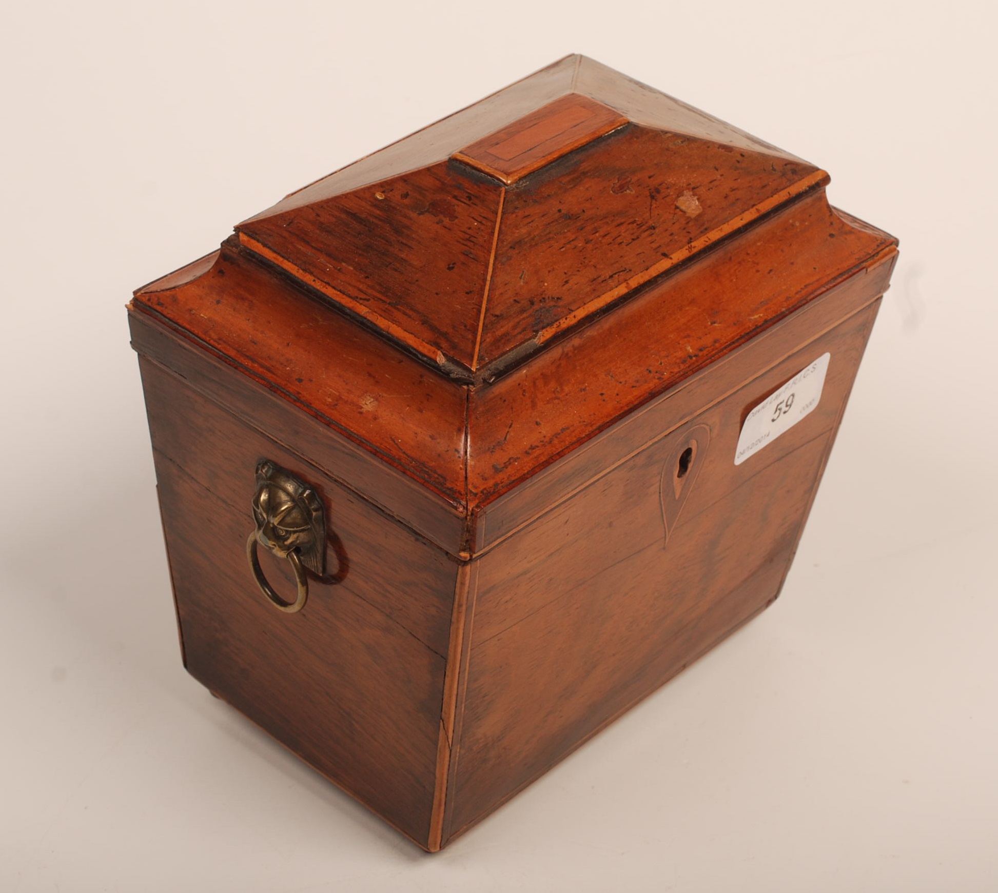 A George III mahogany tea caddy, the stepped lid with concave edges, on a rectangular tapering base,