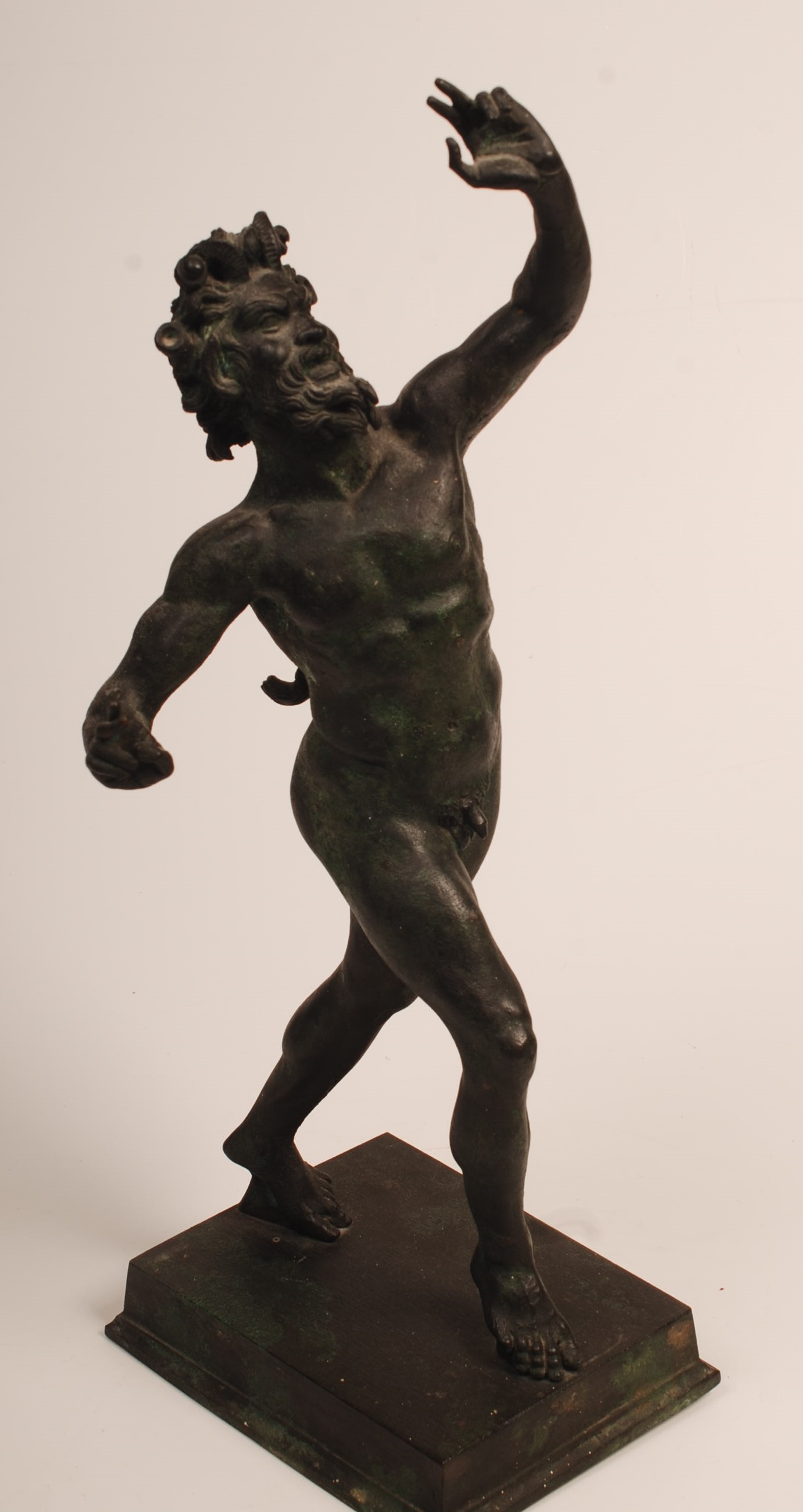 A bronze of a dancing satyr. Height 40.5cm.