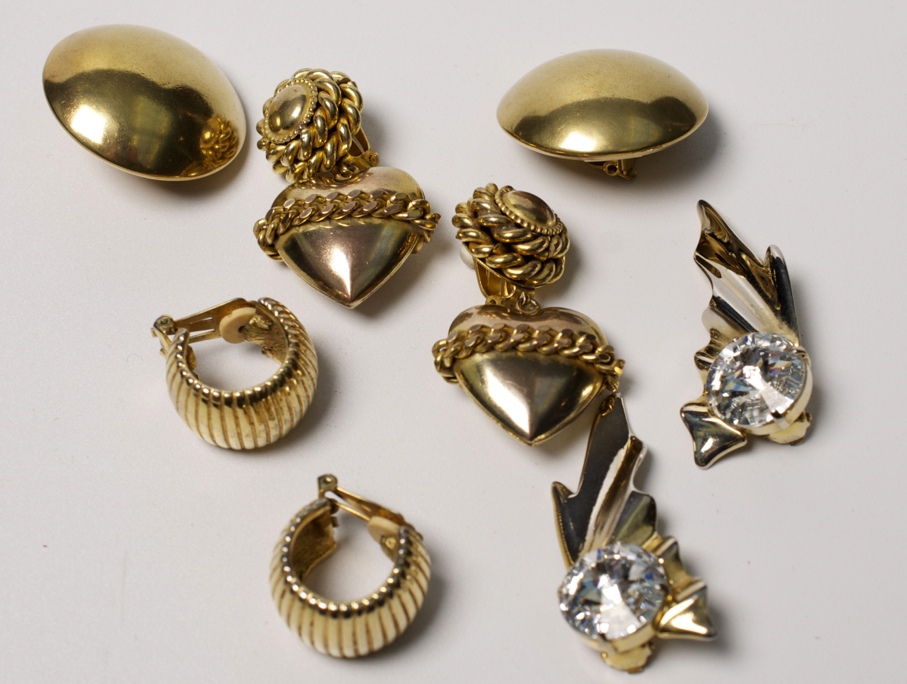Three pairs of earrings by Butler and Wilson together with a pair by Christian Dior.