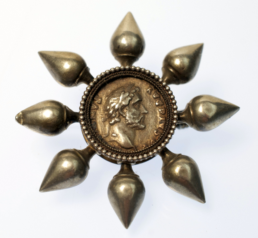 A good Revivalist silver brooch with a central ancient coin.