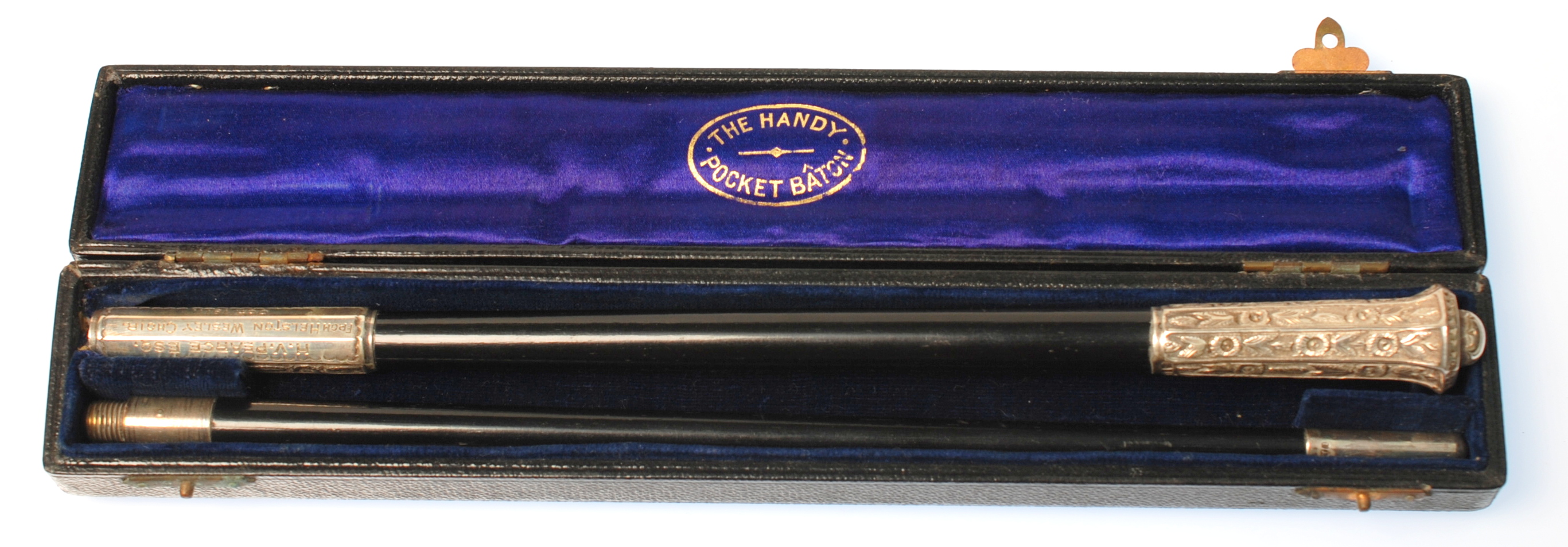The Handy Pocket Baton in ebony with chased silver mounts, the central threaded ferrule inscribed H.