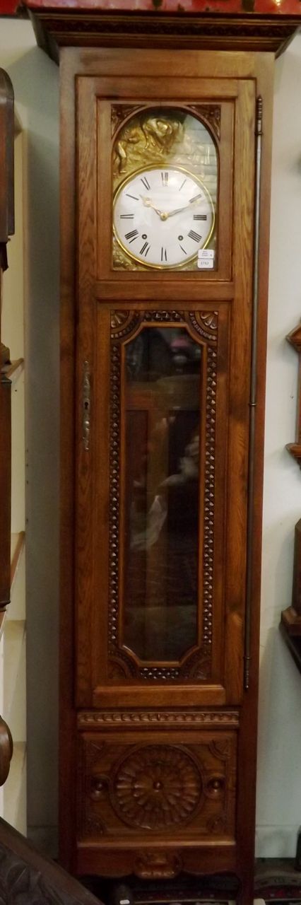 A Breton long case clock in carved oak case, maximum height 229cm. Condition Report: There is 1