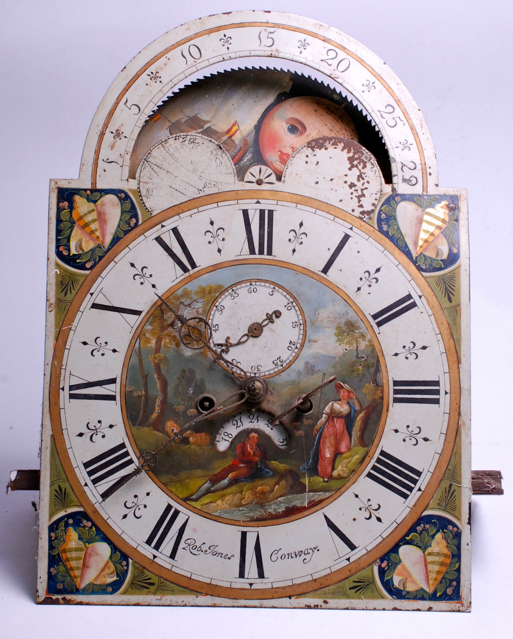 The painted dial and movement from a long case clock, the arch with revolving marine painted lunar