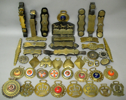 Twenty Victorian and later leather mounted and loose horse harness brasses, eleven horse brasses