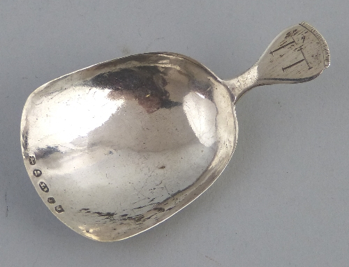 A George IV caddy spoon, with shovel shaped bowl and tapered initialled handle, 6.5cm long,