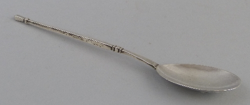 An Arts & Crafts spoon, having oval bowl and hammered square tapering haft, 17cm long, Birmingham