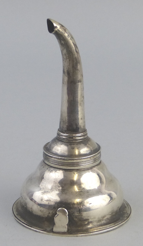 A George III wine funnel, having circular ogee form reservoir with reeded rim and line incised