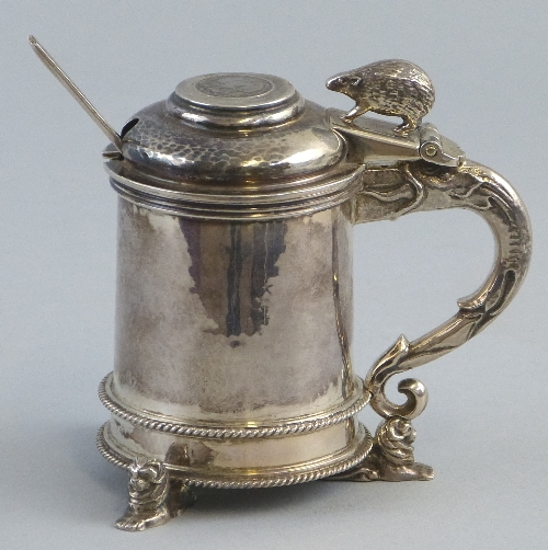 A mustard pot, of cylindrical form with hinged domed lid inset with a Victorian silver groat and