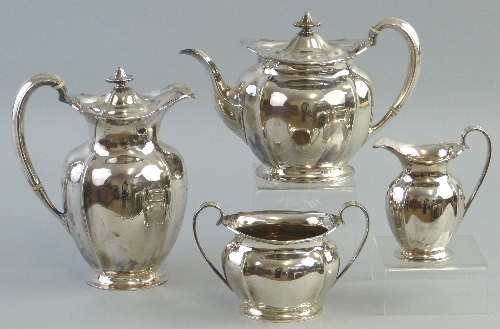 An early 20th Century Scottish matched four piece tea and coffee set, the coffee pot having hinged