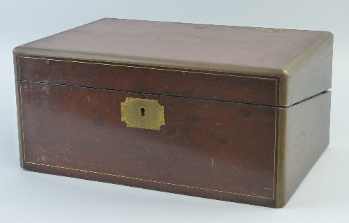 A 19th Century mahogany writing box, of oblong form with brass edges, stringing, cartouche and