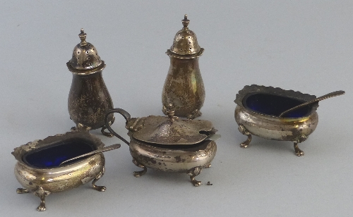 A five piece condiment set, comprising two pepperettes, two salts and a rounded oblong mustard pot