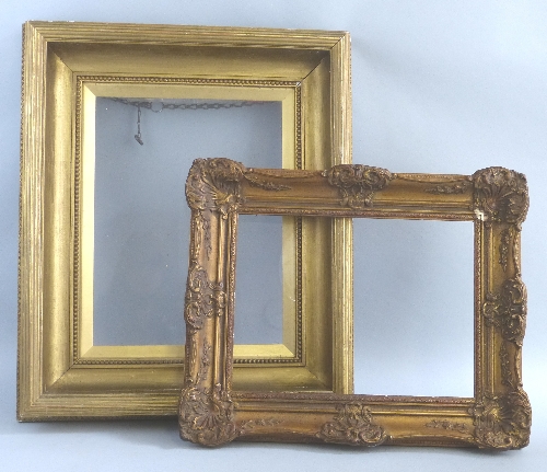 A gilt frame, of concave oblong from with reeded edges, externally 67cm x 57cm, image size 42cm x